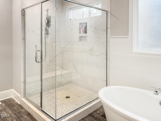 1218 Rogers Farm Rd, Wake Forest, NC 27587 - bathroom featuring a shower stall, a freestanding bath, wood finished floors, and a sink