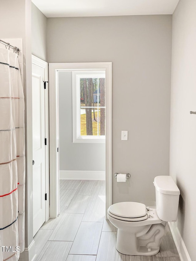 1218 Rogers Farm Rd, Wake Forest, NC 27587 - full bathroom featuring baseboards and toilet