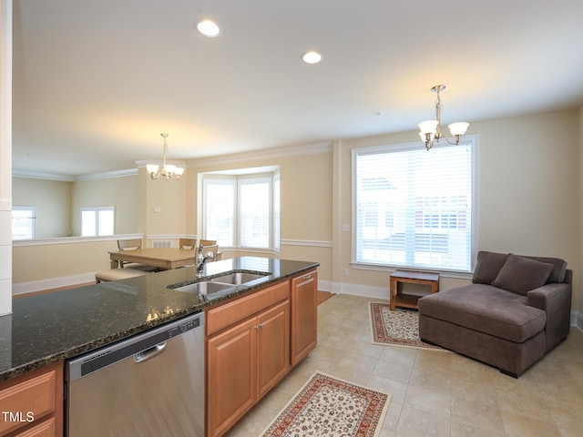 kitchen featuring dishwasher, a chandelier, a sink, dark stone countertops, and ornamental molding