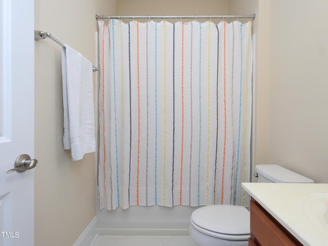 full bath featuring vanity, toilet, and tile patterned floors