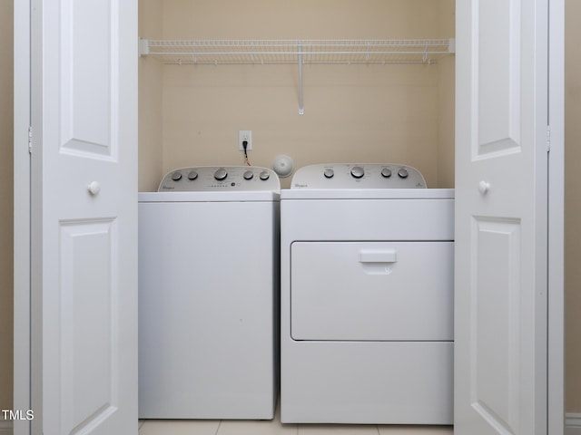 clothes washing area featuring washing machine and dryer
