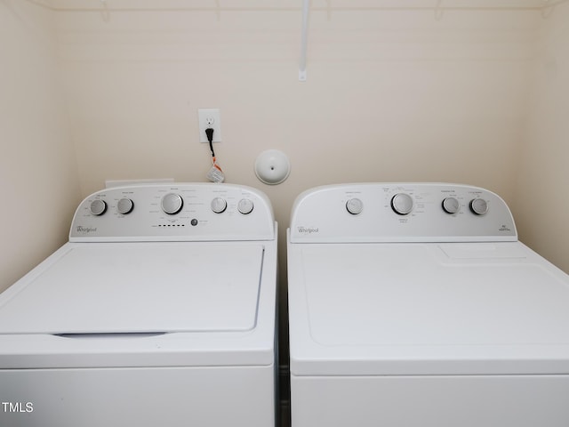 laundry room with independent washer and dryer