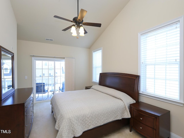bedroom featuring vaulted ceiling, access to outside, light colored carpet, and ceiling fan