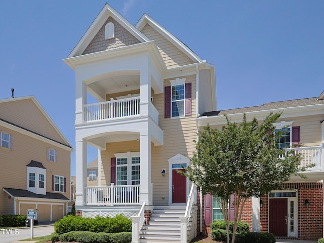 view of front of property with a balcony and a porch