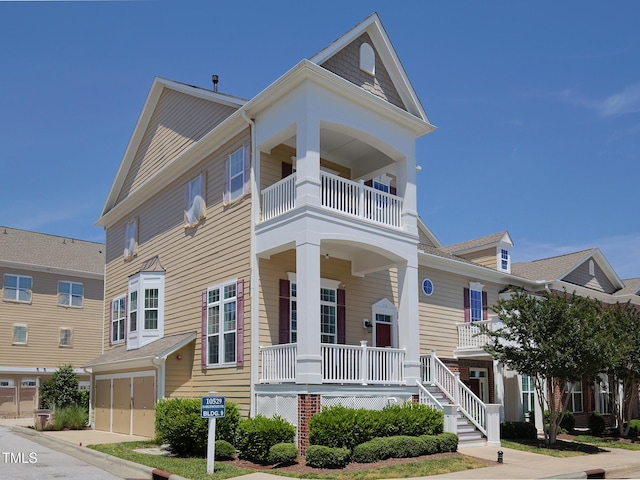 multi unit property with a balcony and a porch