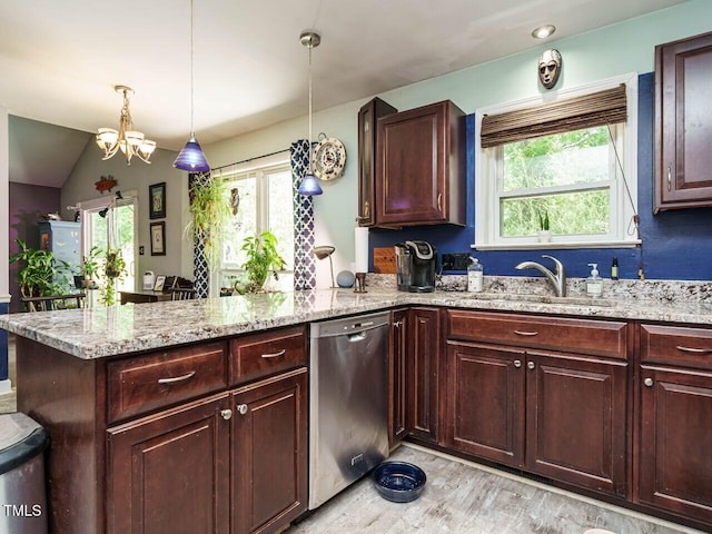 kitchen featuring a sink, a peninsula, a chandelier, stainless steel dishwasher, and light wood-style floors