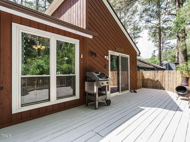 deck with grilling area and fence