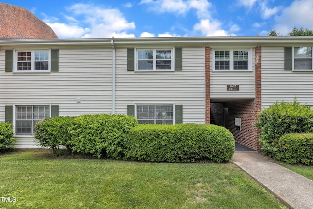 view of home's exterior featuring a yard