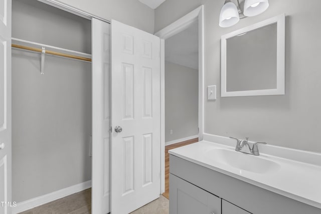 bathroom featuring vanity and baseboards