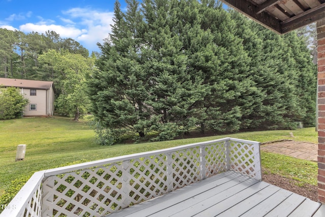 wooden terrace with a yard