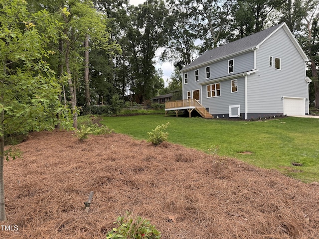 509 Olive Branch Rd, Durham, NC 27703 - rear view of property featuring a wooden deck, a lawn, a garage, and stairs