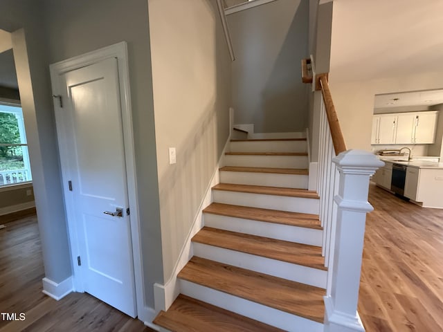 509 Olive Branch Rd, Durham, NC 27703 - staircase featuring wood finished floors and baseboards