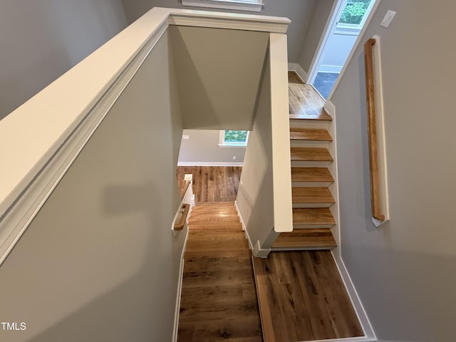 509 Olive Branch Rd, Durham, NC 27703 - staircase featuring wood finished floors and baseboards