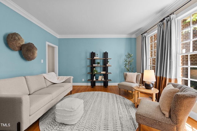 living room with crown molding, wood finished floors, and baseboards