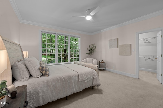 bedroom with crown molding, baseboards, carpet floors, and ceiling fan