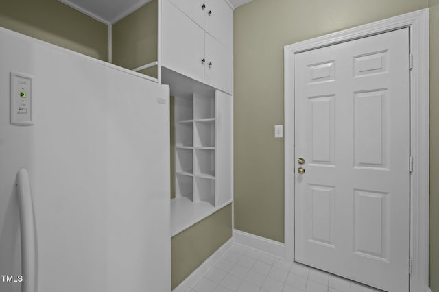 mudroom featuring light tile patterned flooring and baseboards