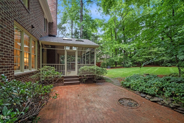 view of patio featuring a sunroom