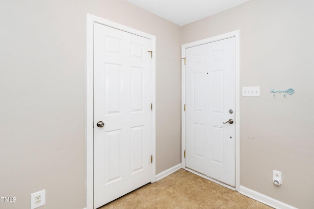 foyer entrance with baseboards