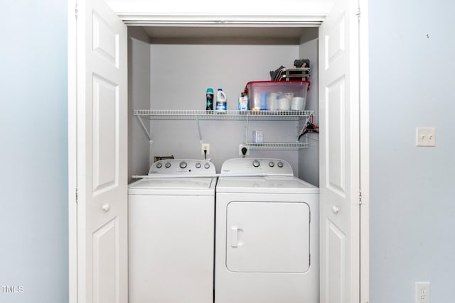 laundry room with washer and clothes dryer