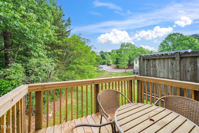 wooden deck featuring outdoor dining space