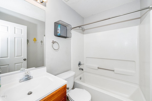 bathroom featuring toilet, shower / bathtub combination, vanity, and a textured ceiling