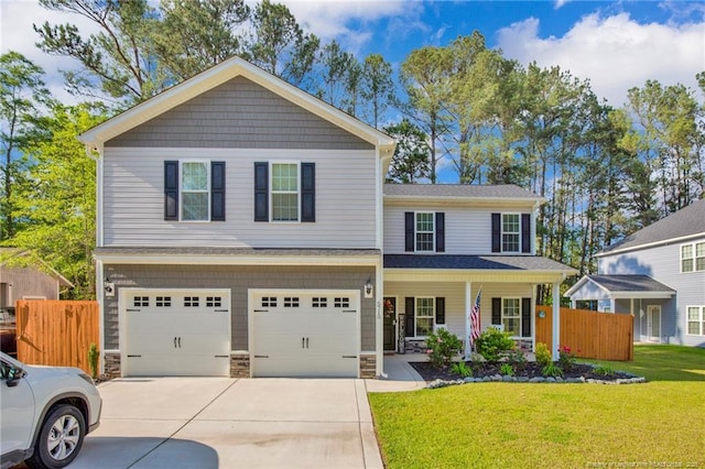 view of front of home with fence, covered porch, an attached garage, concrete driveway, and a front lawn