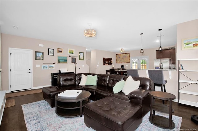 living area featuring dark wood finished floors and baseboards