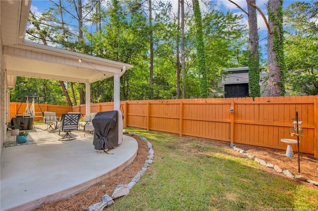 view of yard with a patio and a fenced backyard