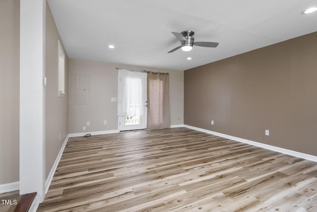 unfurnished room featuring a ceiling fan, wood finished floors, baseboards, and recessed lighting