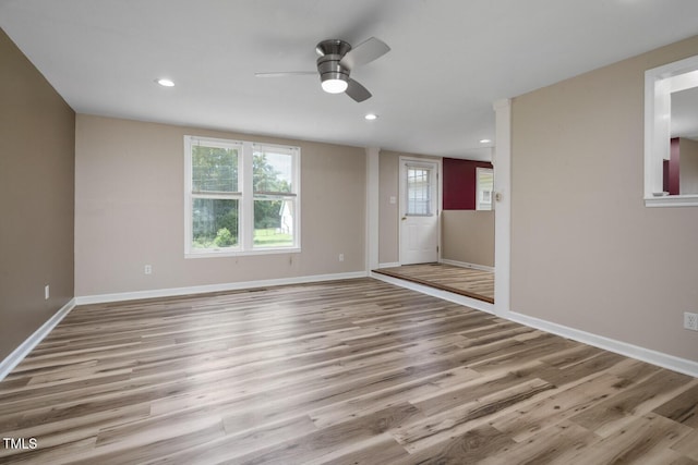 spare room with ceiling fan, recessed lighting, wood finished floors, and baseboards