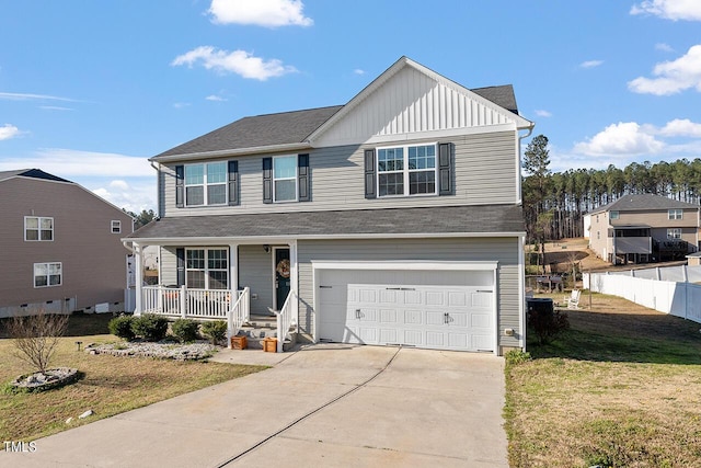 traditional-style home featuring covered porch, board and batten siding, a garage, and driveway