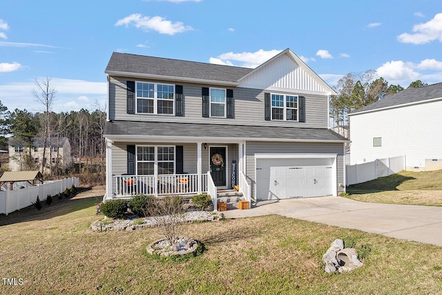 traditional-style house featuring covered porch, concrete driveway, and a garage