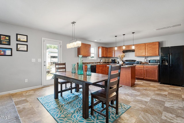 dining space featuring healthy amount of natural light and baseboards