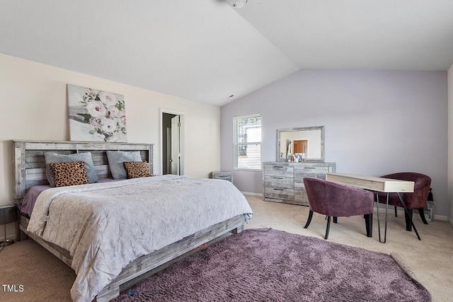 bedroom featuring light carpet, lofted ceiling, and baseboards