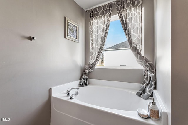 bathroom featuring a garden tub