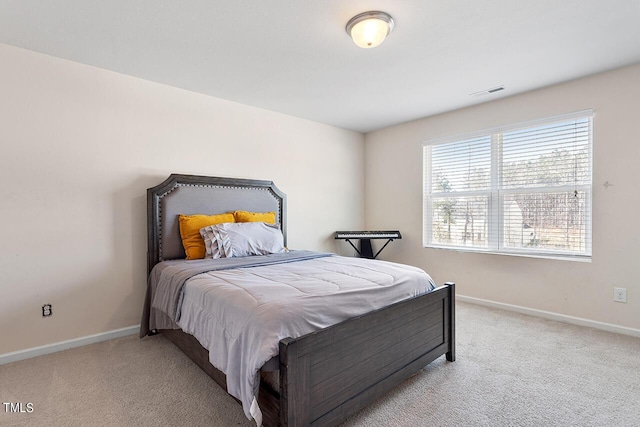 bedroom with carpet and baseboards