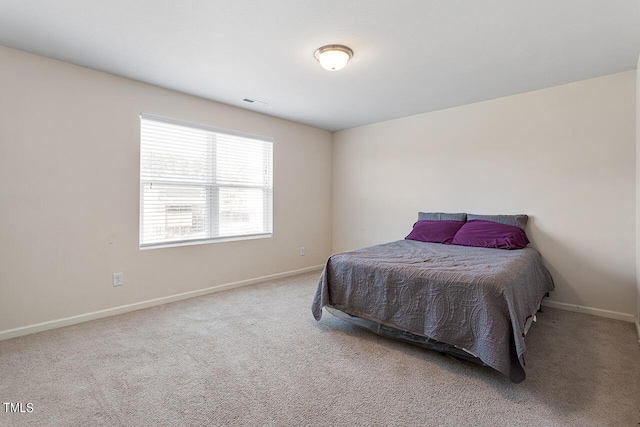 bedroom with baseboards and carpet flooring