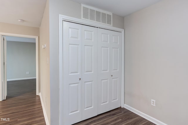 600 Audubon Lake Dr Unit 6B13, Durham, NC 27713 - unfurnished bedroom with dark wood finished floors, baseboards, and a closet