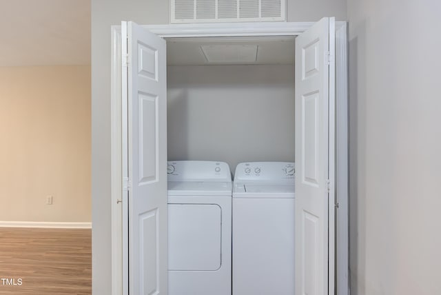600 Audubon Lake Dr Unit 6B13, Durham, NC 27713 - clothes washing area featuring separate washer and dryer and wood finished floors