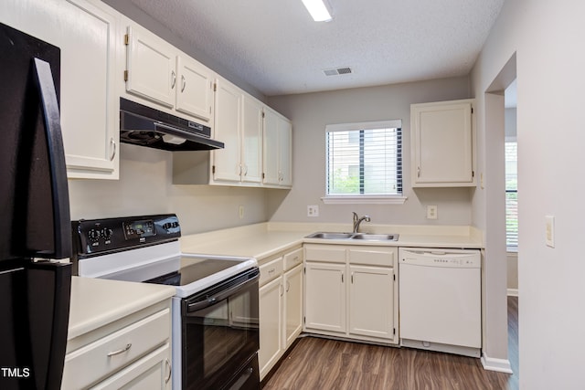 600 Audubon Lake Dr Unit 6B13, Durham, NC 27713 - kitchen with dishwasher, electric stove, freestanding refrigerator, under cabinet range hood, and a sink