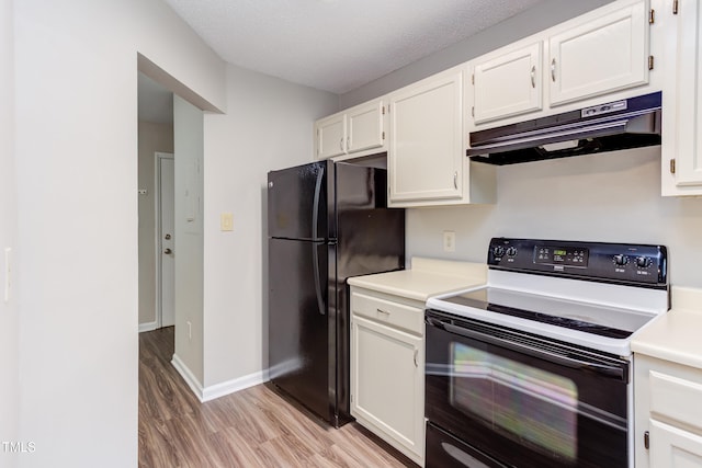 600 Audubon Lake Dr Unit 6B13, Durham, NC 27713 - kitchen with electric range oven, under cabinet range hood, freestanding refrigerator, light wood finished floors, and light countertops