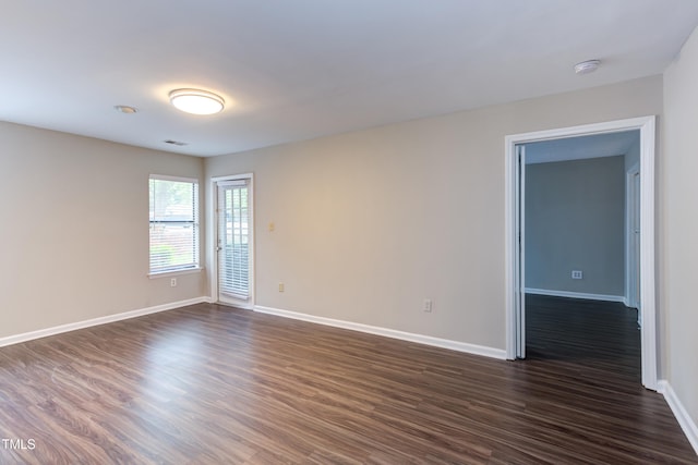600 Audubon Lake Dr Unit 6B13, Durham, NC 27713 - spare room featuring dark wood finished floors, baseboards, and a smoke detector