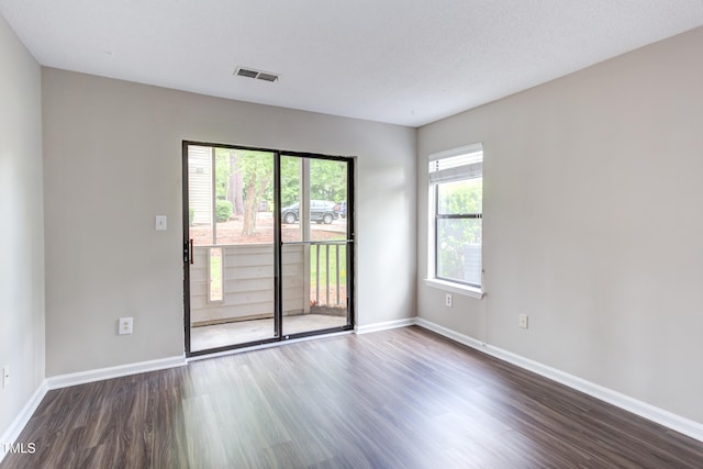 600 Audubon Lake Dr Unit 6B13, Durham, NC 27713 - unfurnished room with dark wood-style flooring and baseboards