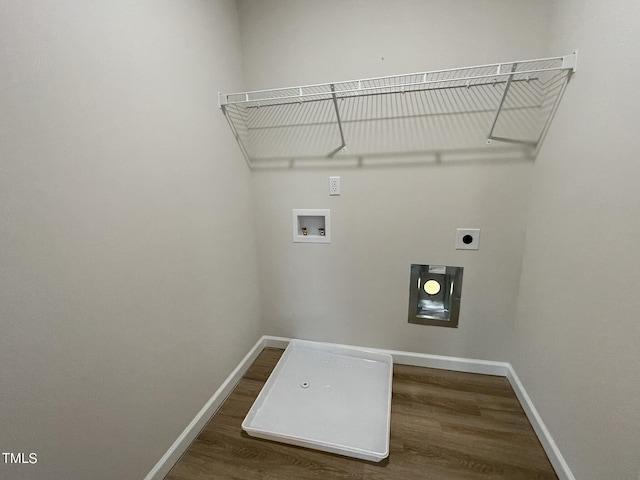 laundry area with laundry area, hookup for an electric dryer, baseboards, and wood finished floors
