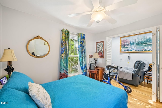 bedroom featuring wood finished floors and ceiling fan