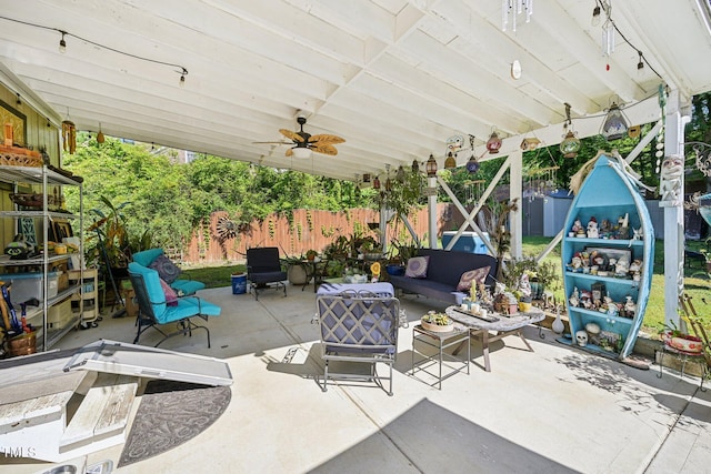 view of patio / terrace with a fenced backyard, an outdoor hangout area, and a ceiling fan