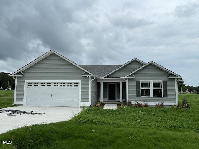 167 Lotus Ave, Smithfield, NC 27577 - ranch-style home featuring an attached garage, roof with shingles, driveway, and a front yard