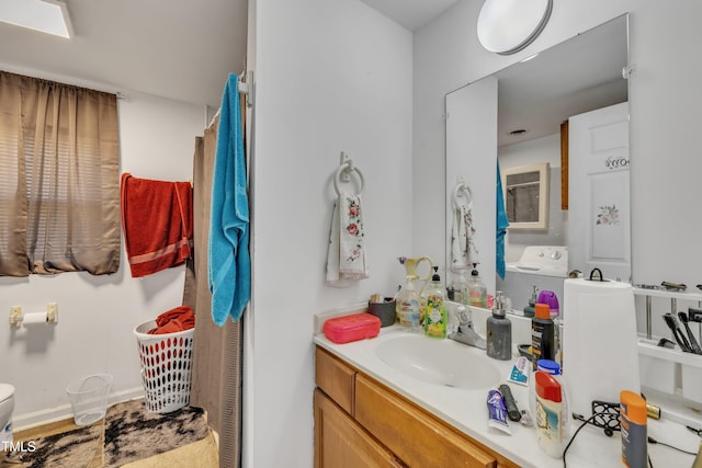 bathroom with vanity and toilet