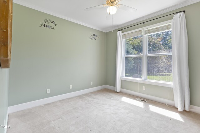 207 N Hopkins Ave, Spring Hope, NC 27882 - carpeted empty room featuring crown molding, baseboards, and a ceiling fan