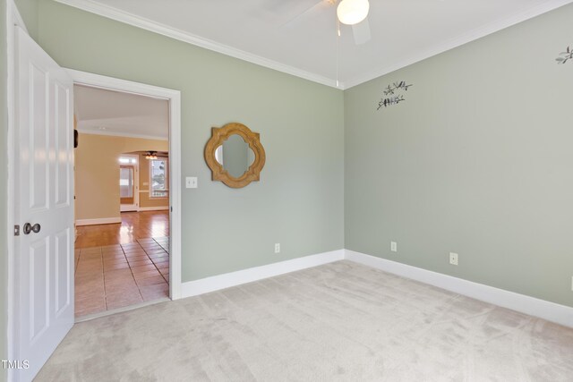 207 N Hopkins Ave, Spring Hope, NC 27882 - carpeted spare room featuring crown molding, a ceiling fan, arched walkways, and baseboards